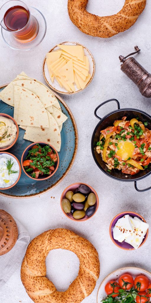 Traditional Turkish breakfast spread with simit, menemen, and fresh ingredients