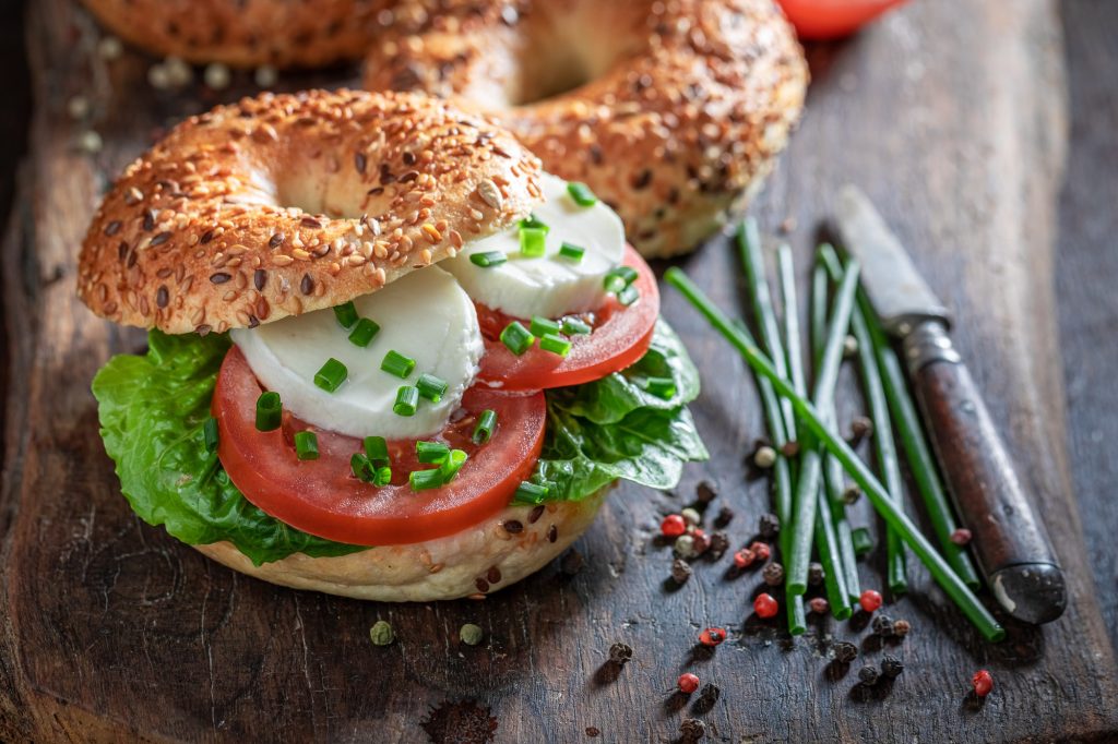 Homemade breakfast bagel with fresh toppings